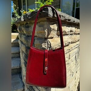 Red, shoulder bag. Gently used. Non-smoker house.